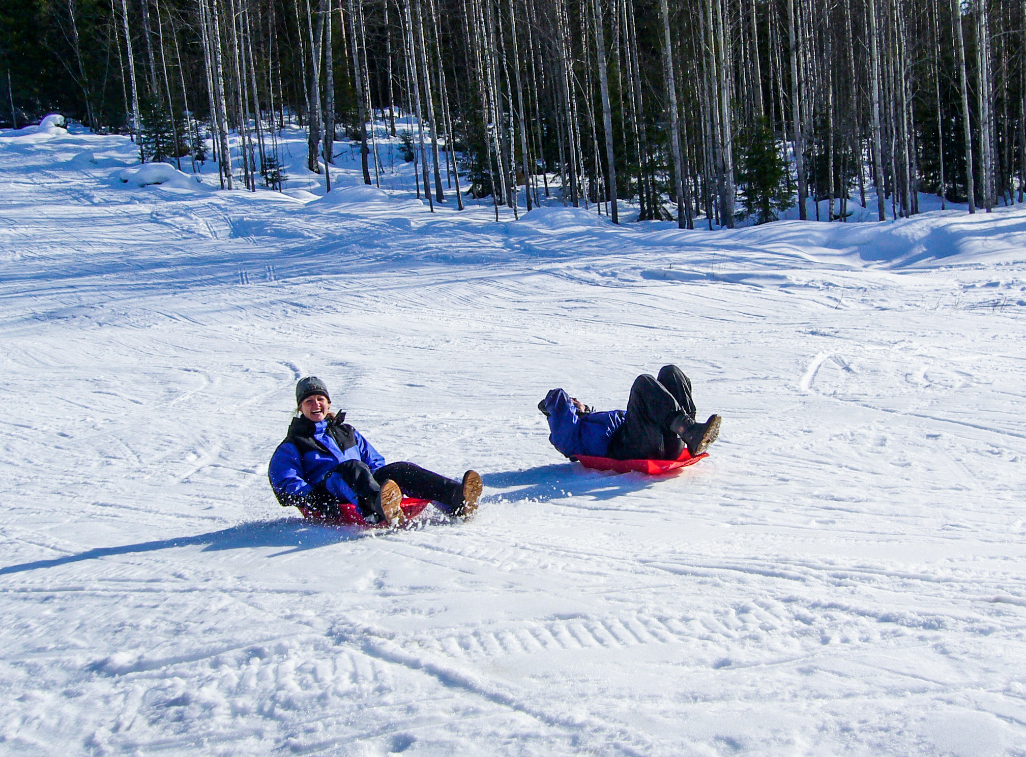 two people sledding